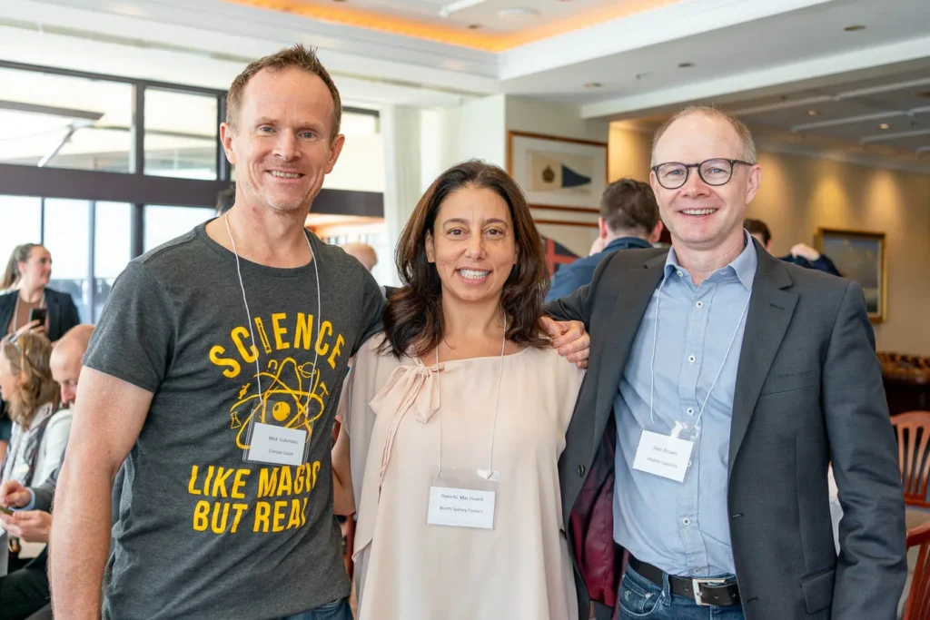 Mick Liubinskas, Daniella Mac Dowell and David McEwen smile for a photo to Sydney event photographer