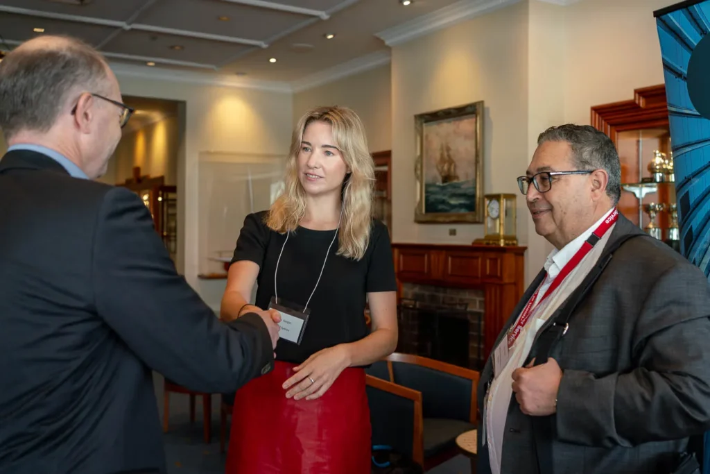 Event photographer capturing candid networking scenes