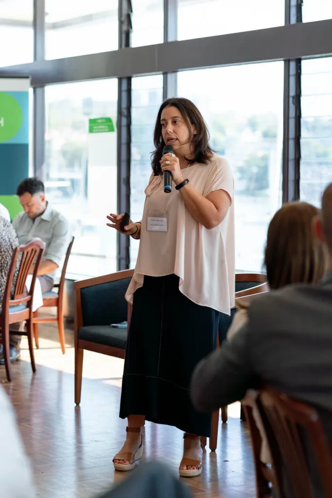Close-up of speaker addressing the audience at CitySwitch networking