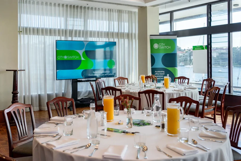 Wide panoramic of Royal Sydney Yacht Squadron interior set for networking
