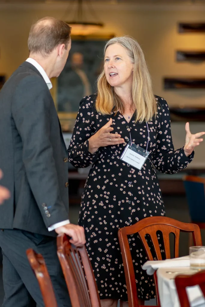 Professional handshake between delegates at net zero event
