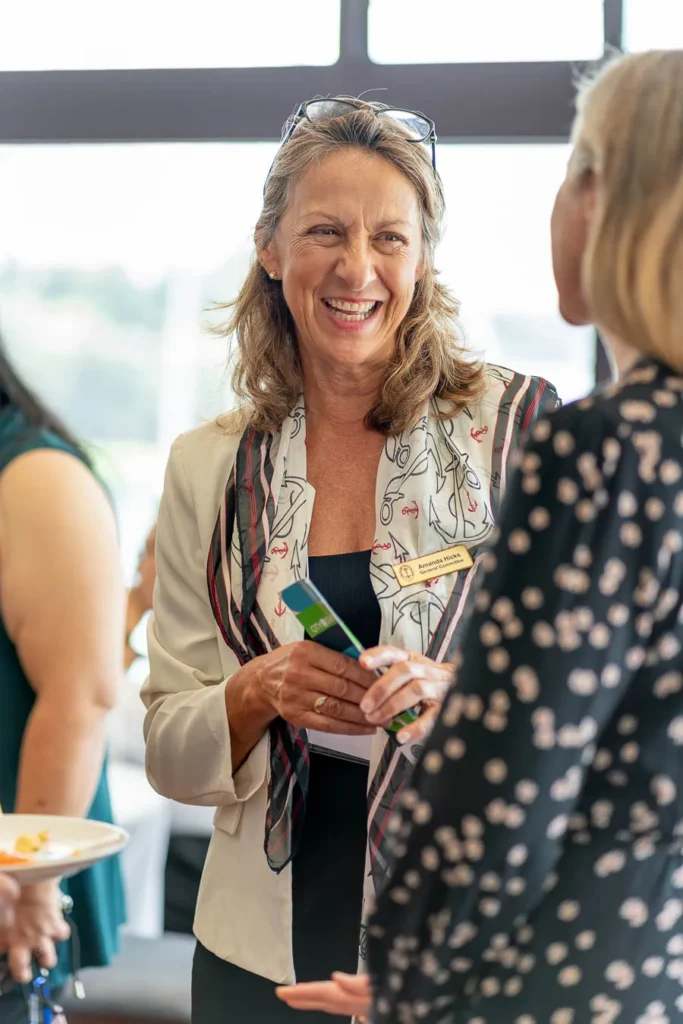 Candid laughter between guests at CitySwitch breakfast