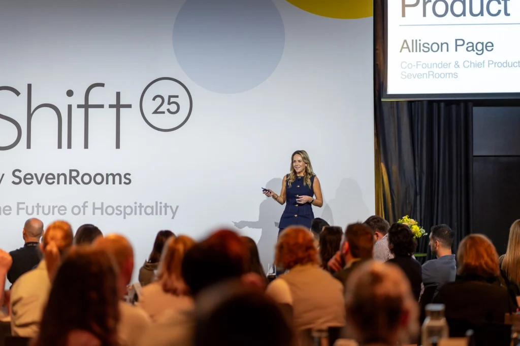 Conference presentation captured with branded backdrop