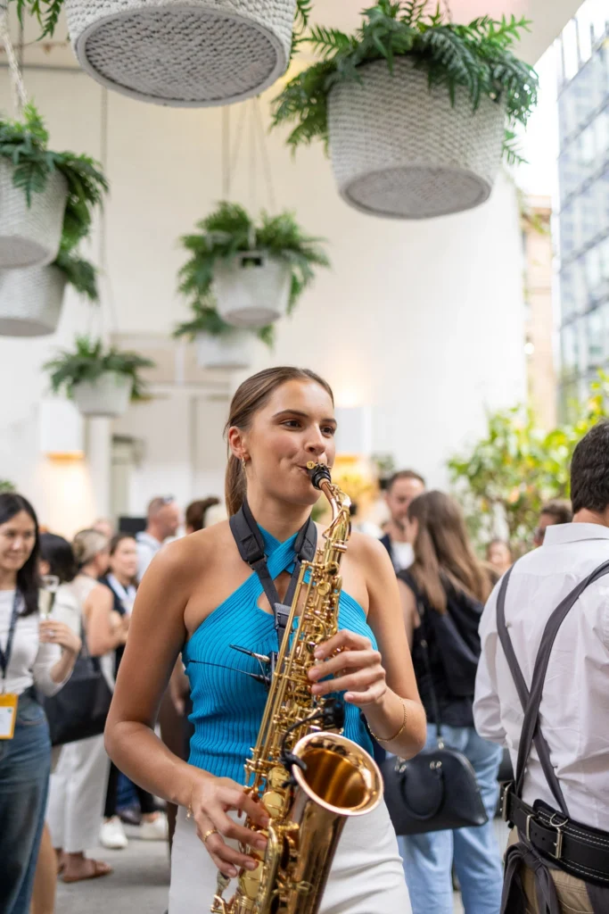 Saxophonist performing at conference afterparty