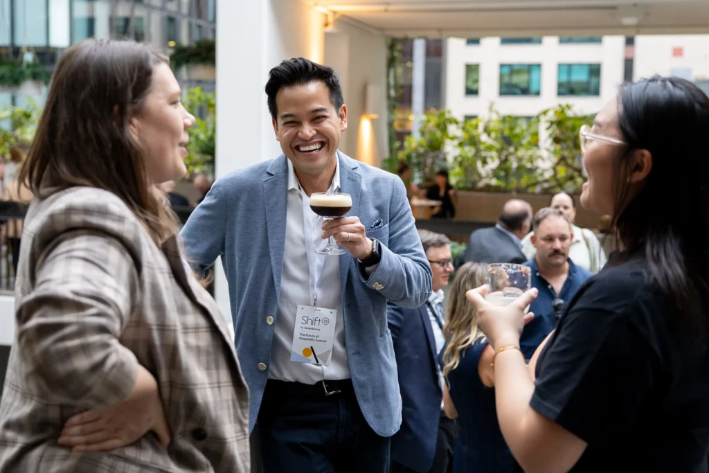 Guests laughing and enjoying conference experience