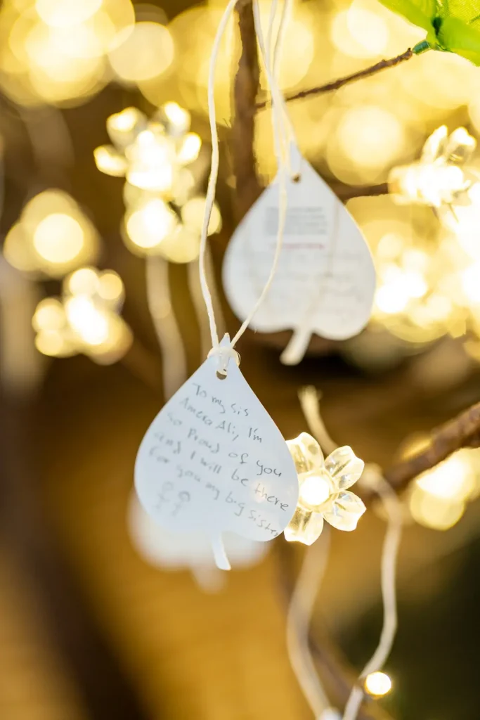 Close up of commitment leaves hanging on the illuminated tree at the conference
