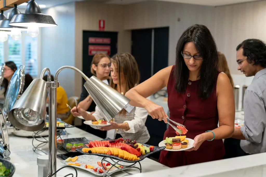 Guests selecting food from the catering buffet at the conference in Parramatta