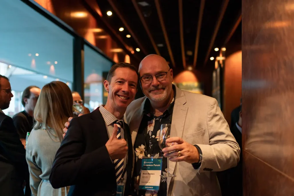 Two guests posing at the Guidewire Insurance Forum Sydney 2023 evening event