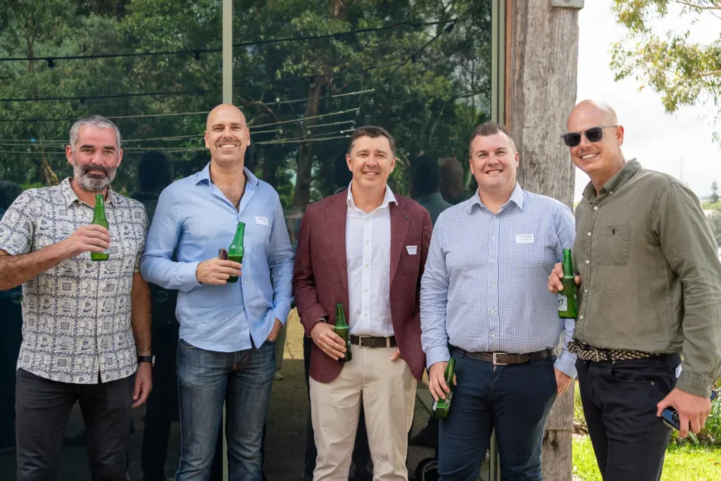 Group portrait of guests outside Deckhouse Woolwich during the Michael Morgan OAM lunch