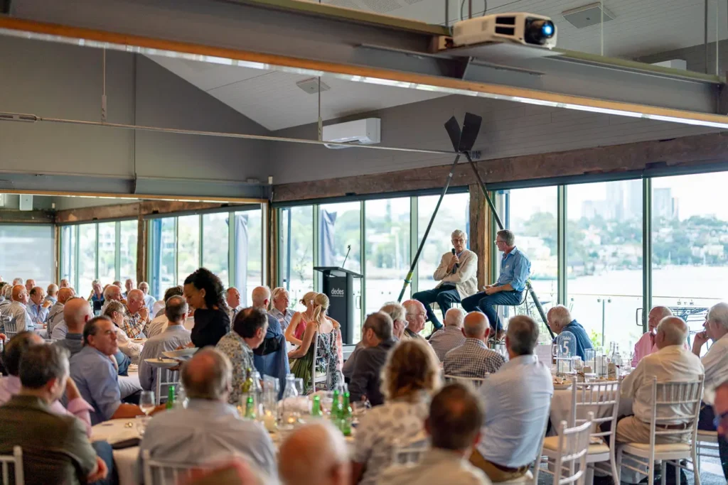 Wide room view of speeches and guests at the Michael Morgan OAM lunch