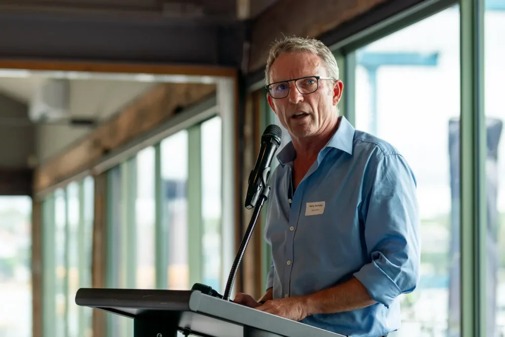 Speaker at the podium during the Michael Morgan OAM lunch at Deckhouse Woolwich
