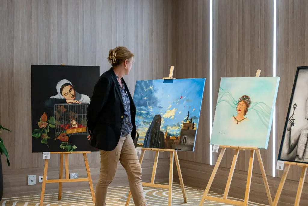 Guest viewing artwork display at the Silence to Power conference at PARKROYAL Parramatta
