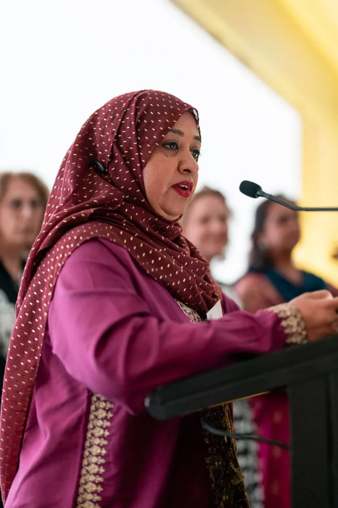 Speaker addressing the audience from the podium during the conference at PARKROYAL Parramatta