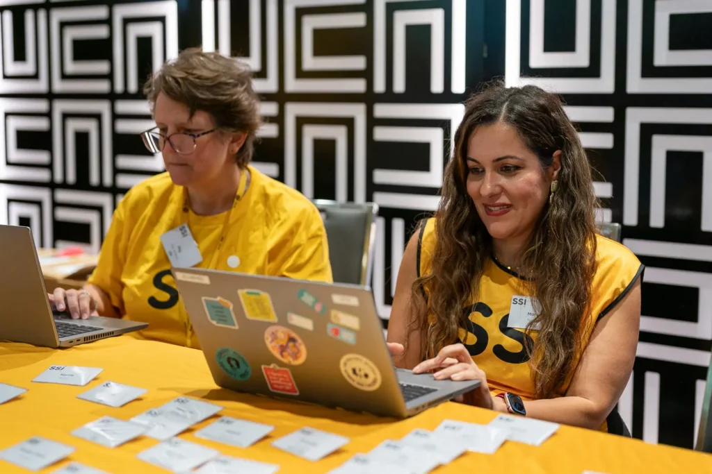 SSI team members working at the registration desk during the conference at PARKROYAL Parramatta