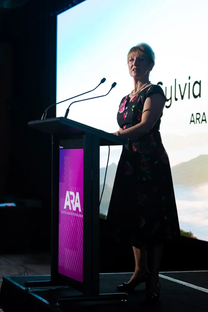 Female speaker presenting on stage at the Australasian Reporting Awards black-tie gala dinner in Sydney