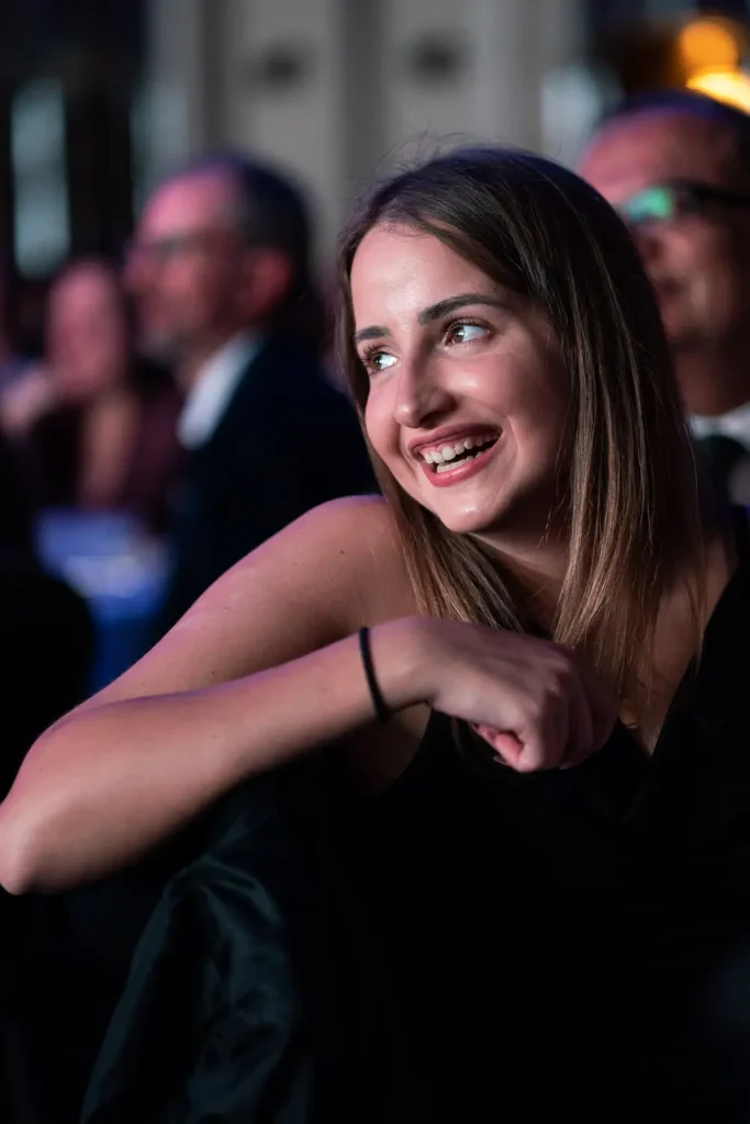 Female guest smiling during the Australasian Reporting Awards black-tie gala dinner