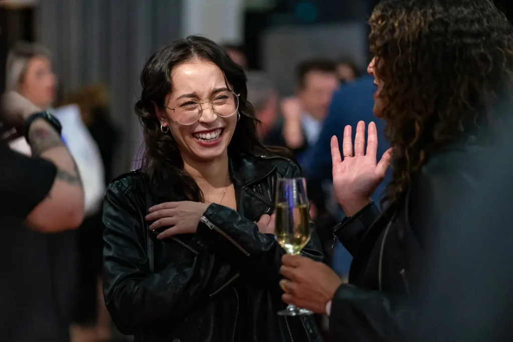 Audience members smiling during Australian Web Awards presentation