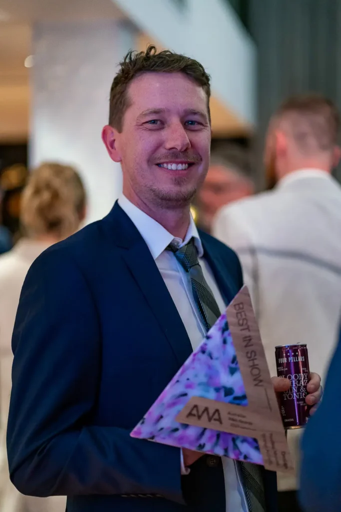 Best in Show winner holding Australian Web Awards trophy