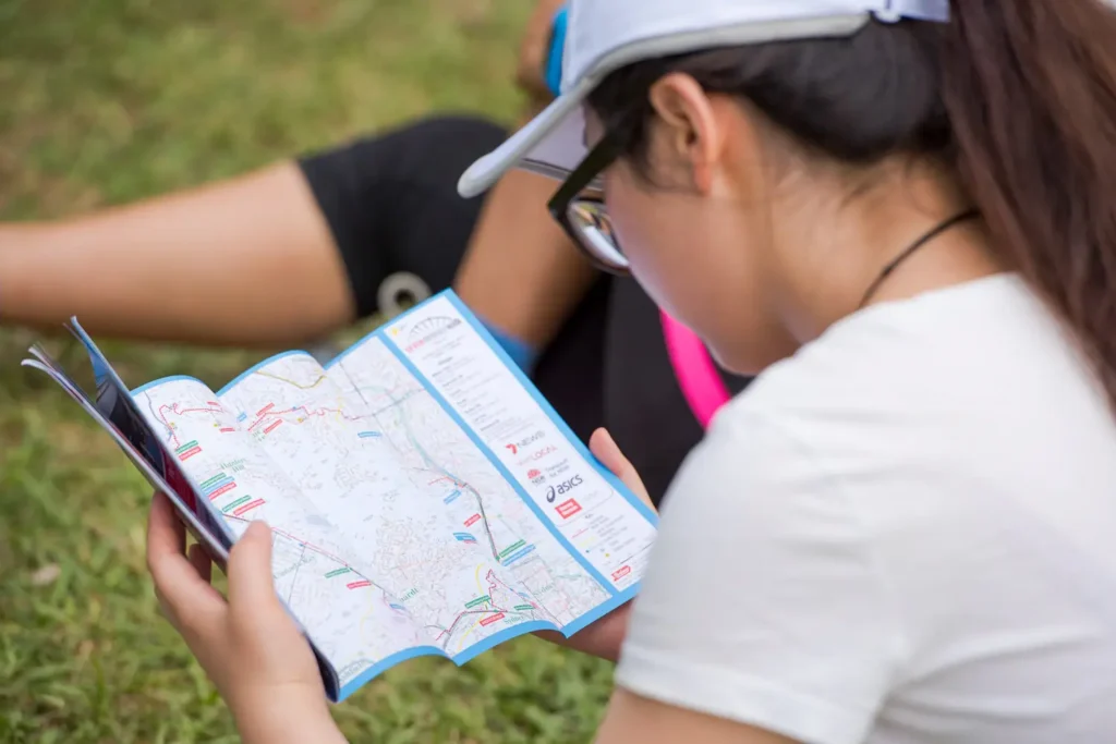 Participant reading the Bridges Walk route map during the Sydney event