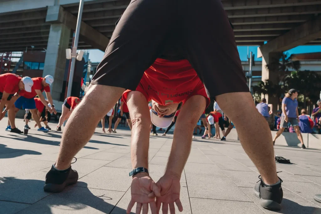 Dragon boat team stretching before races during Lunar New Year at Darling Harbour Sydney