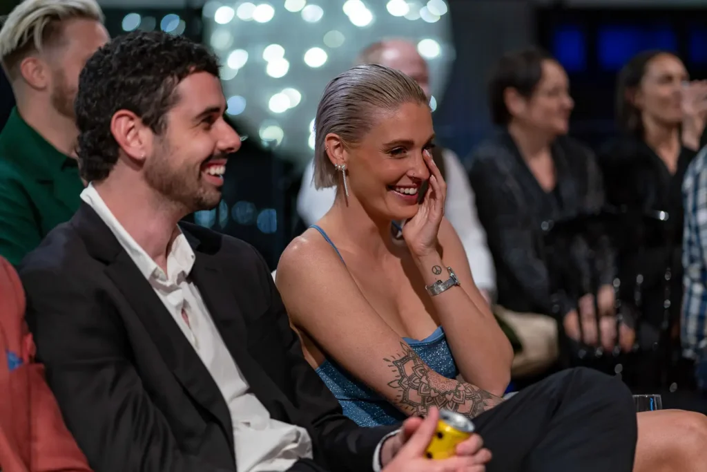 Audience members laughing during awards presentation