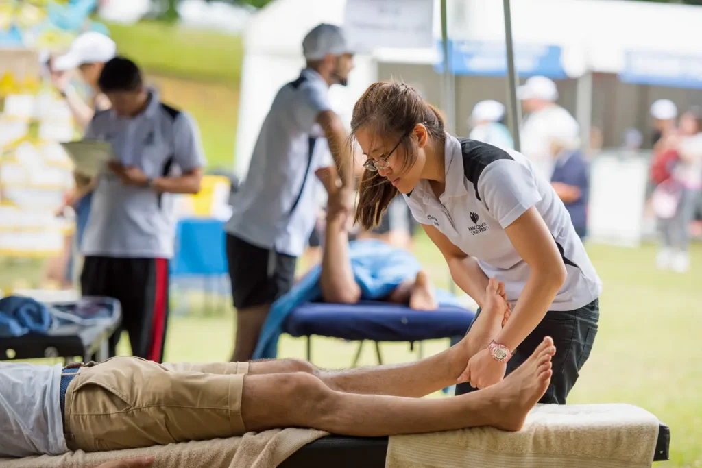 Participants relaxing near the event medical area during the Bridges Walk
