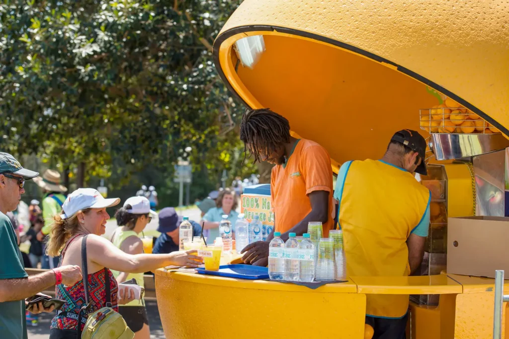Fresh orange juice stand serving walkers at the Bridges Walk charity event in Sydney