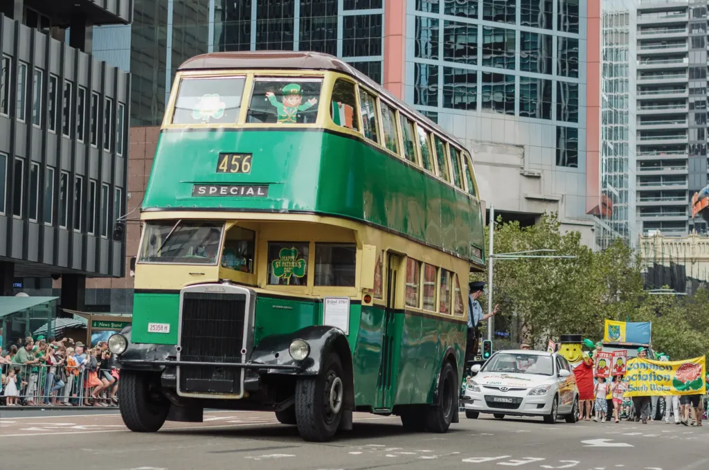 Historic double decker bus driving through Sydney St Patrick’s Day parade