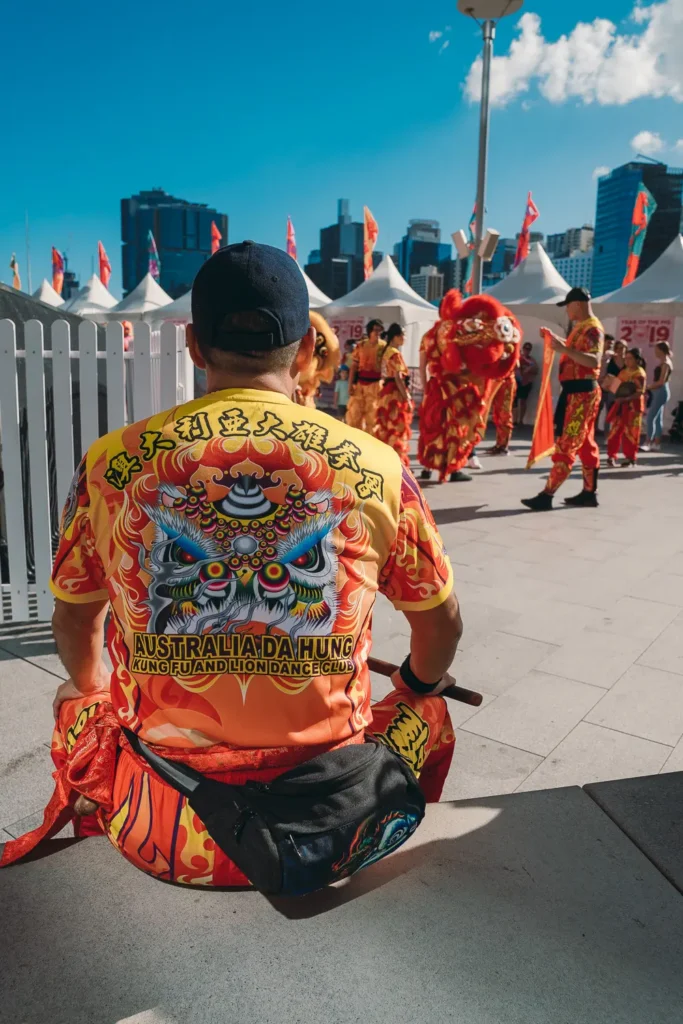 Performer preparing for lion dance during Lunar New Year celebrations at Darling Harbour