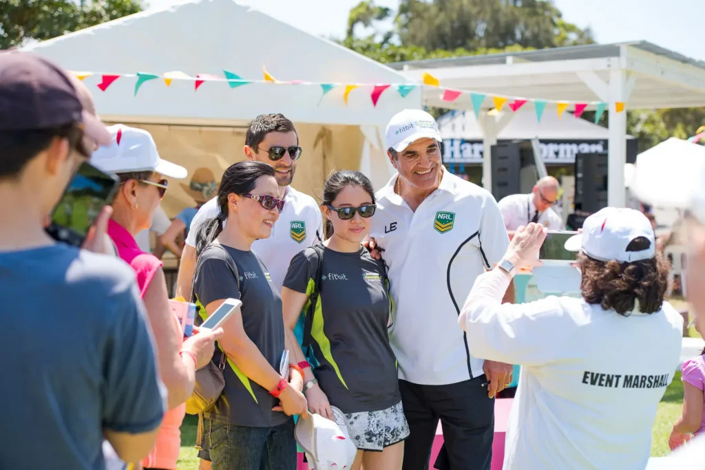 Event guests posing for photos at the Seven Bridges Walk community event