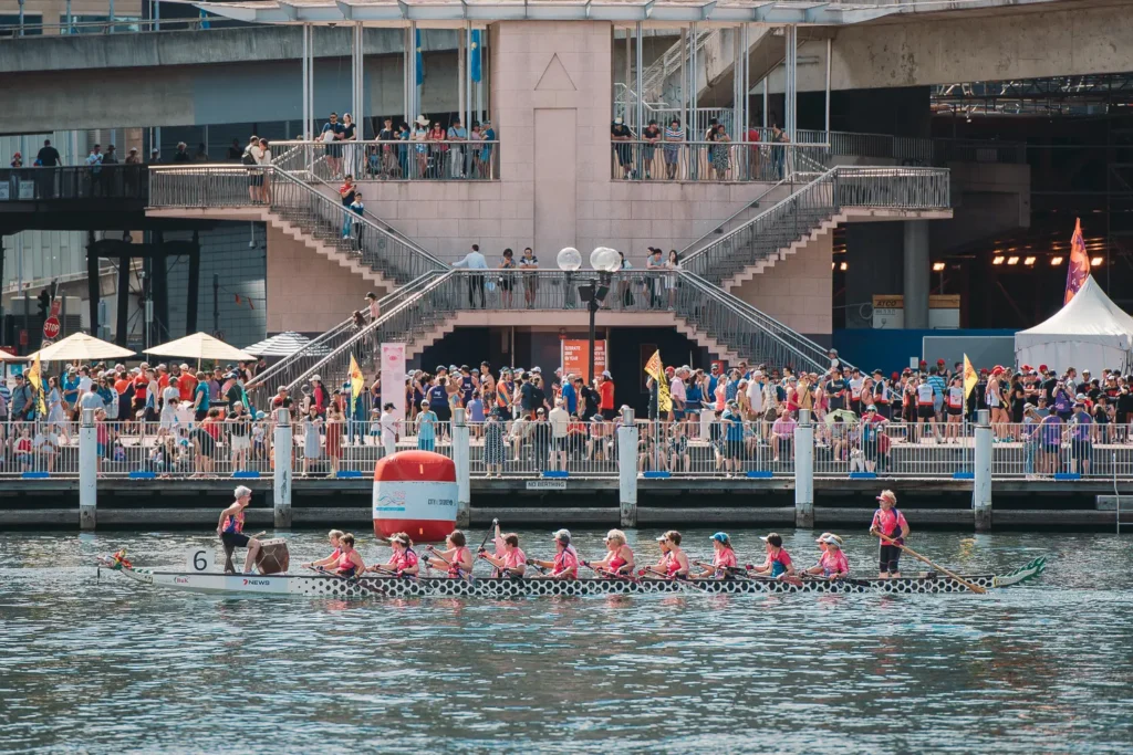 Spectators gathered along the Darling Harbour waterfront watching dragon boat races