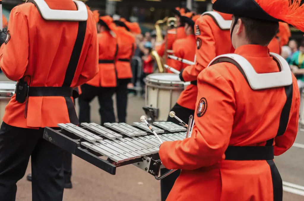 Marching band performer playing glockenspiel during Sydney St Patrick’s Day parade
