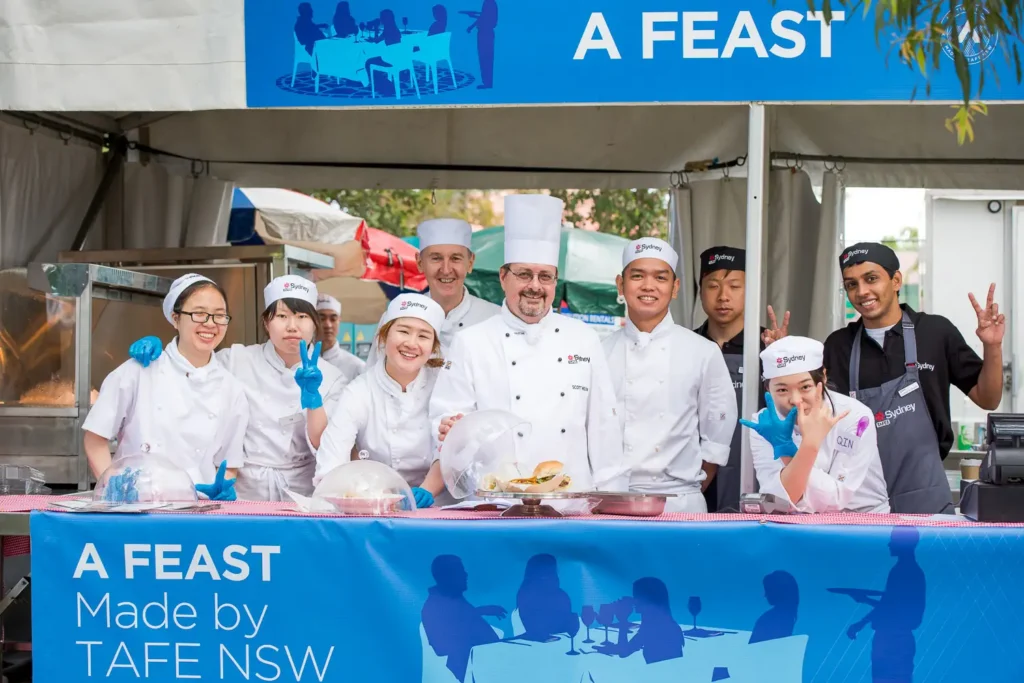 TAFE NSW hospitality team serving food at the Bridges Walk event village