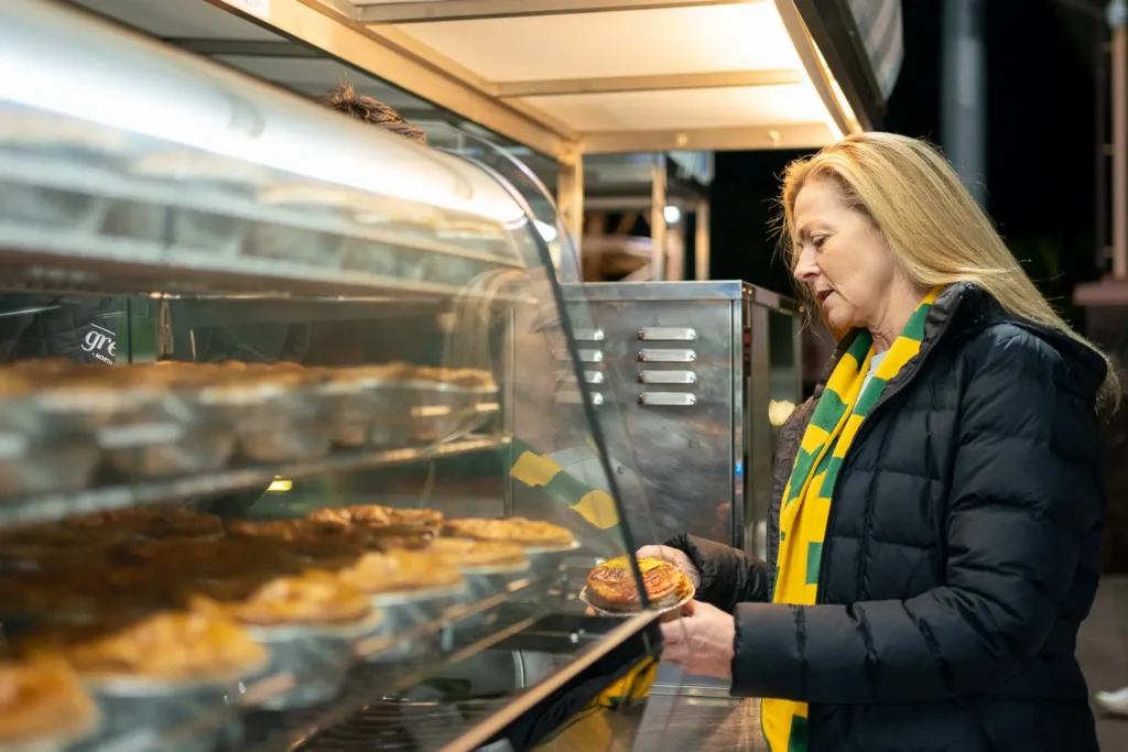 Supporter buying food before watching the Matildas at North Sydney Oval
