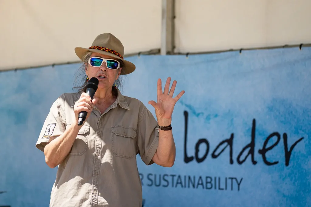 Environmental speaker presenting on stage at the Coal Loader Sustainability Festival in Sydney