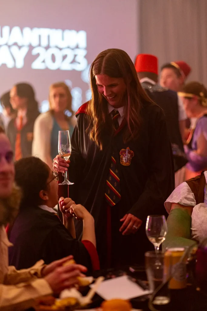 Candid moment between costumed guests at the Quantum Day celebration