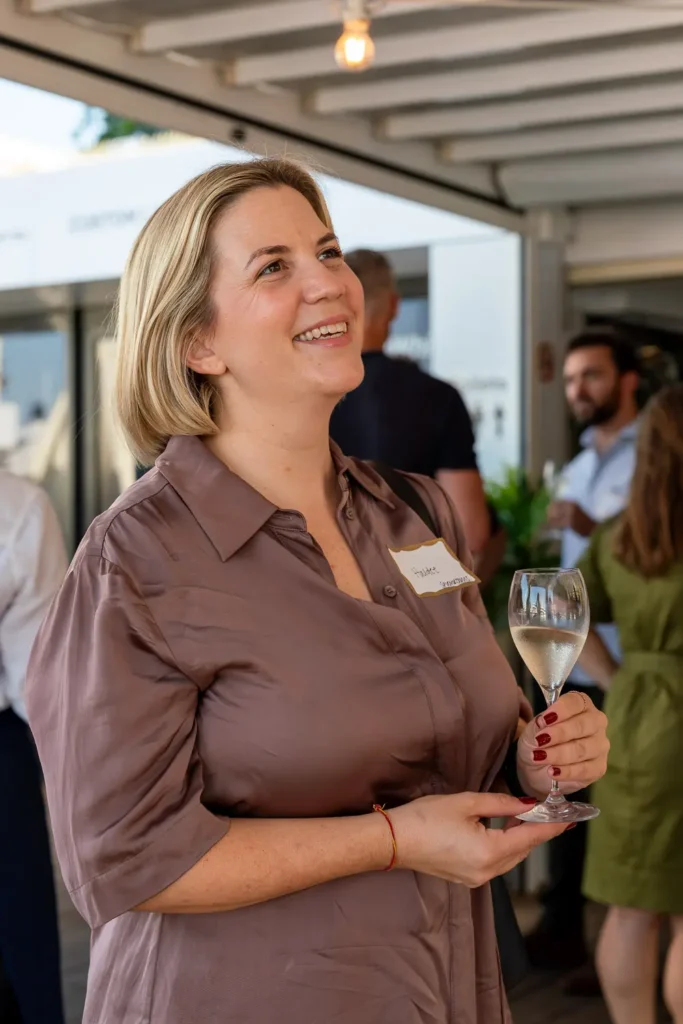 Guest with a glass of wine at the SHIFT Soirée in Rose Bay