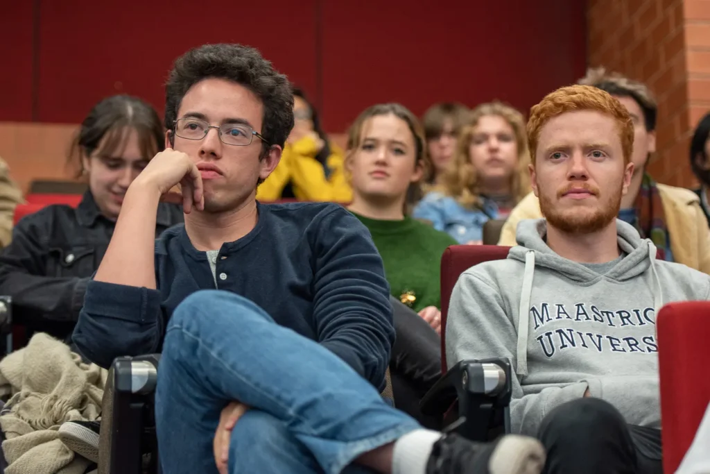 Students listening to the Socialism vs Capitalism debate at the University of Sydney