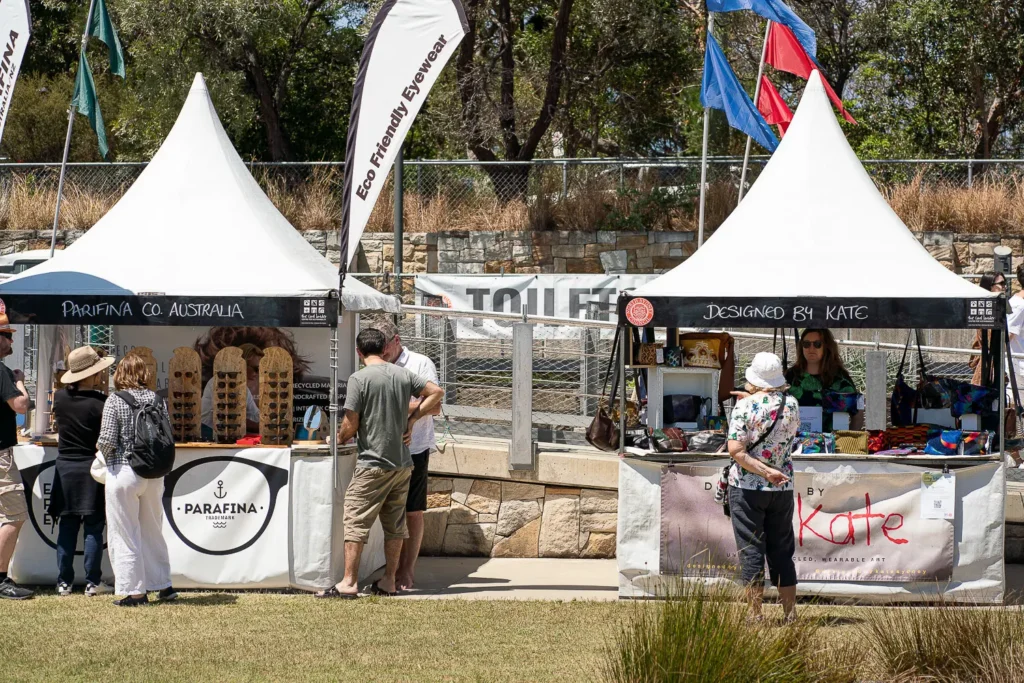 Eco-friendly market stalls with sustainable products at an outdoor Sydney festival