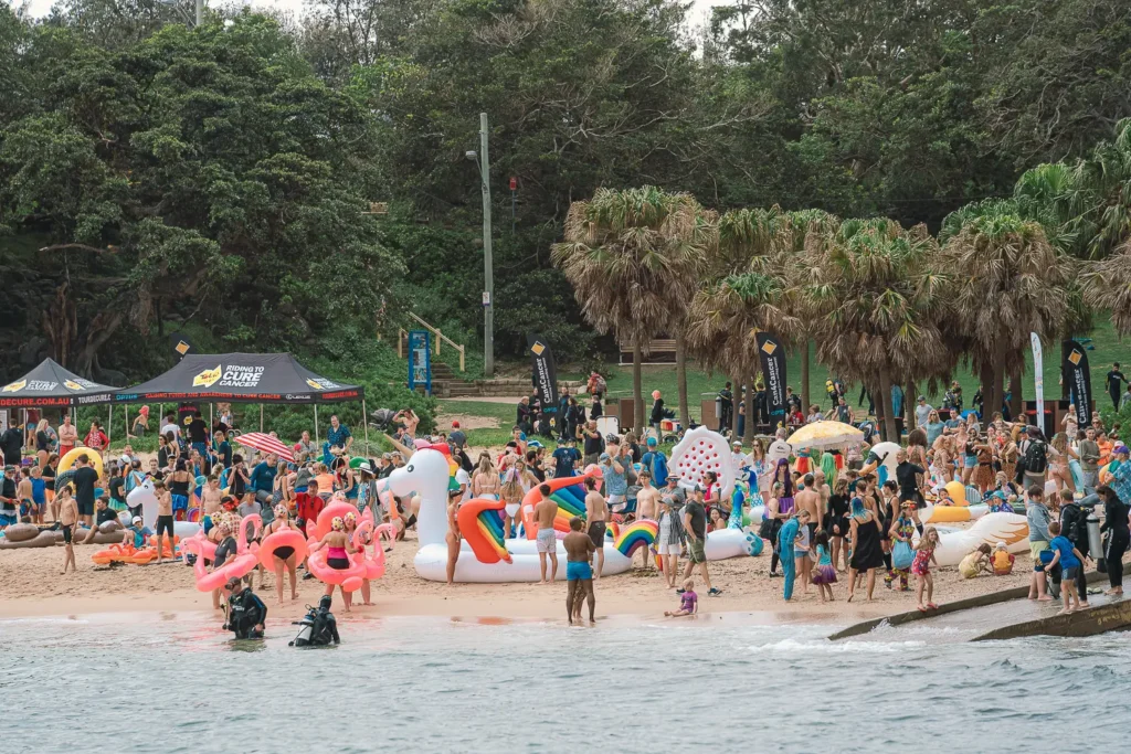 Crowds and colourful inflatables gathered at Shelly Beach for the charity inflatable boat race