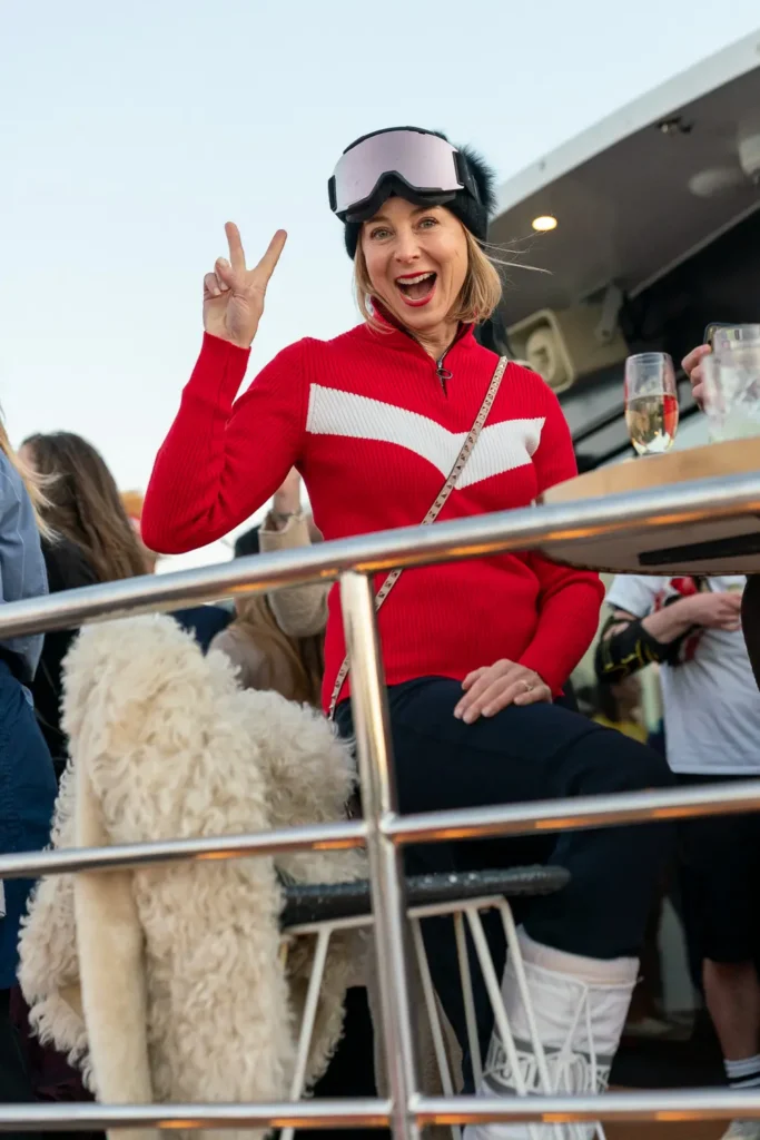 Guest in ski goggles and red outfit enjoying a Sydney corporate costume party