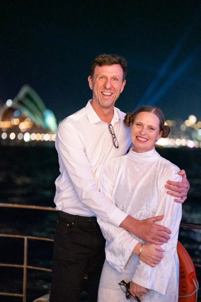Guests posing together with the Sydney Opera House in the background