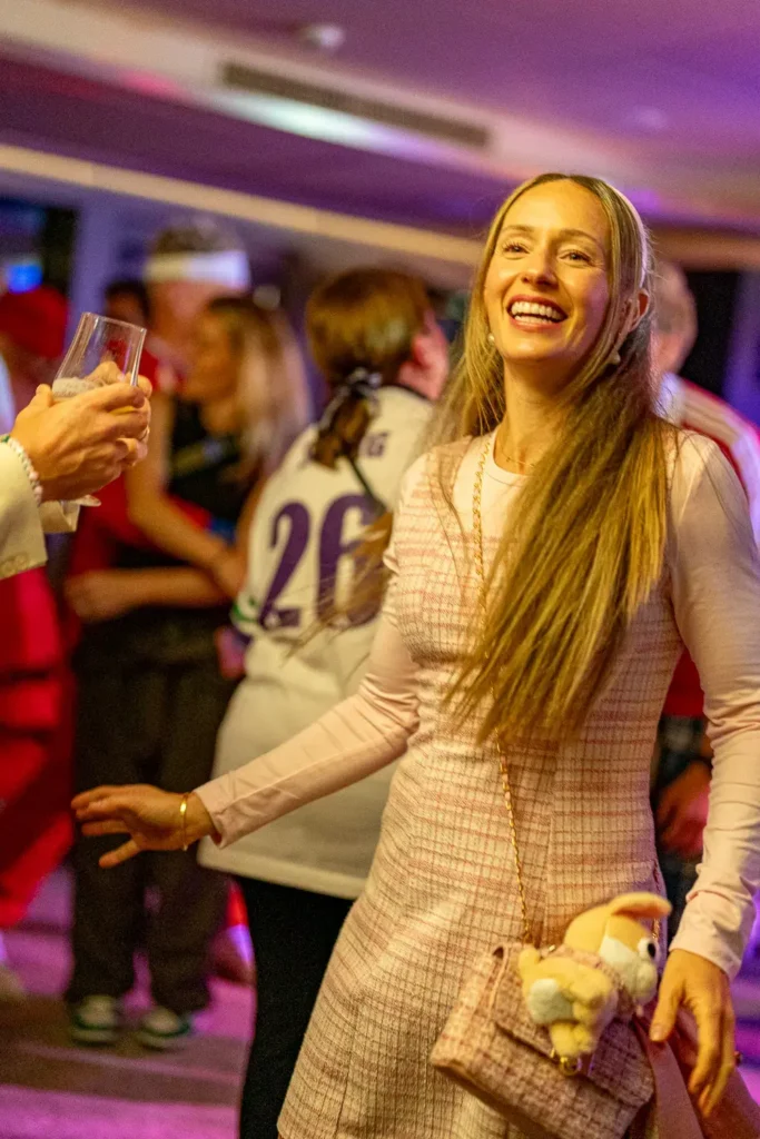 Smiling guest enjoying a colourful corporate party in Sydney