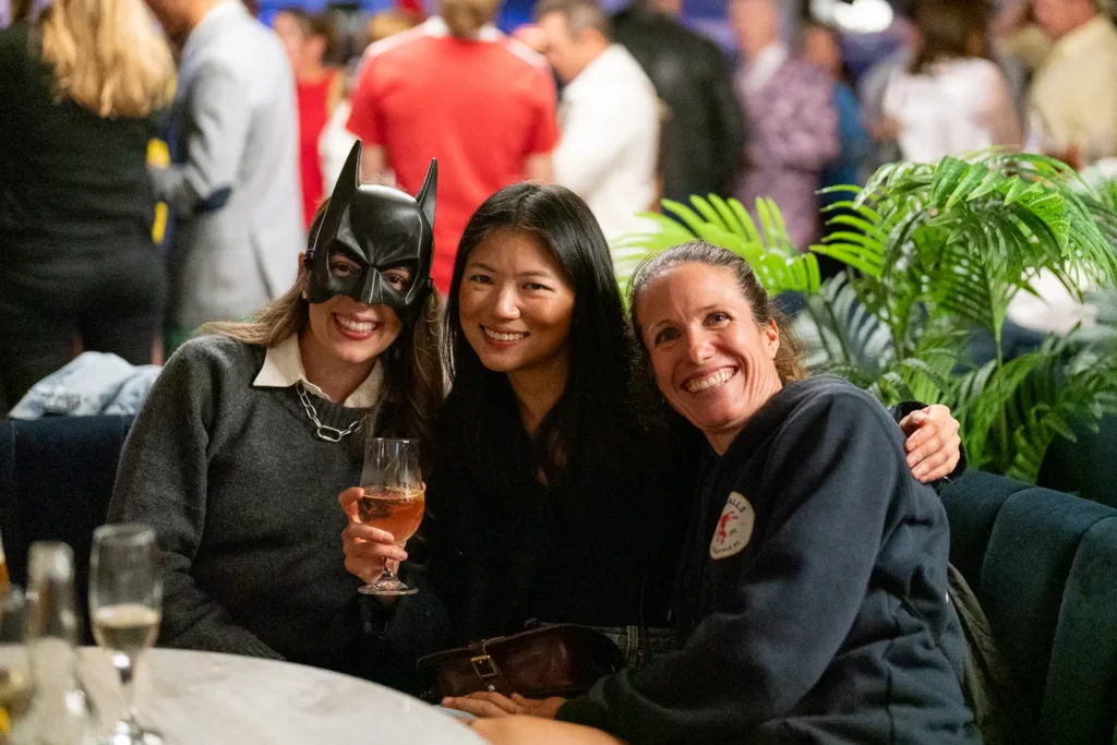 Three guests posing together in costumes at a corporate event in Sydney