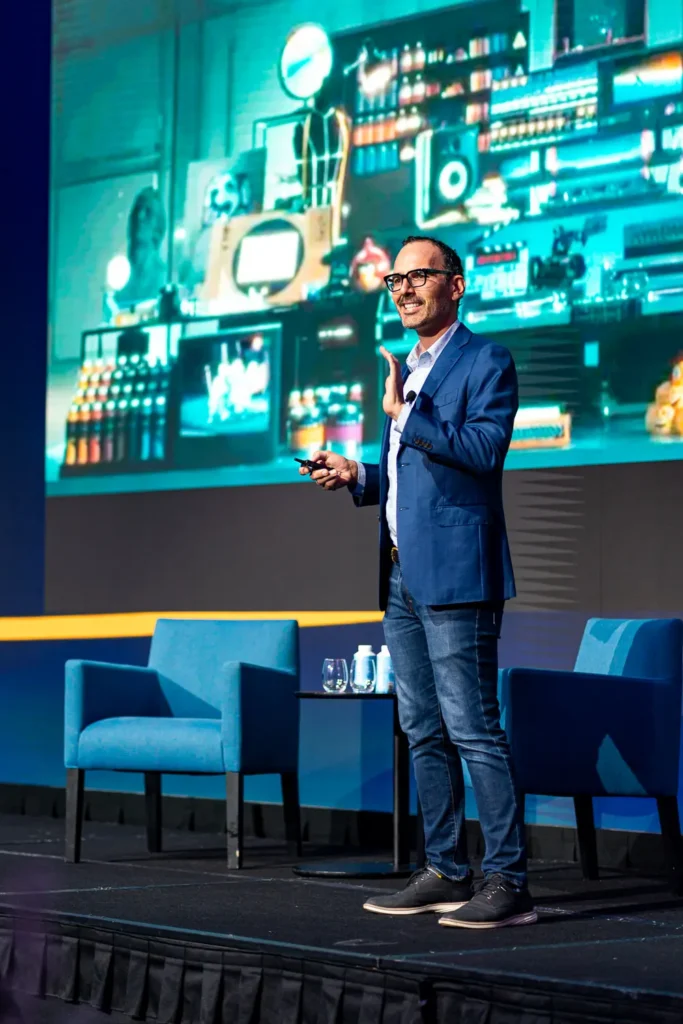Corporate event speaker presenting on stage at Four Seasons Hotel Sydney