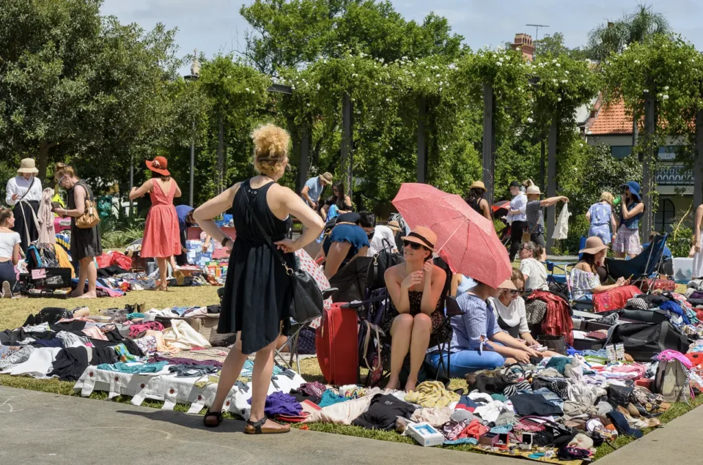 Community market and second-hand clothing stalls photographed at Glebe Street Fair Sydney