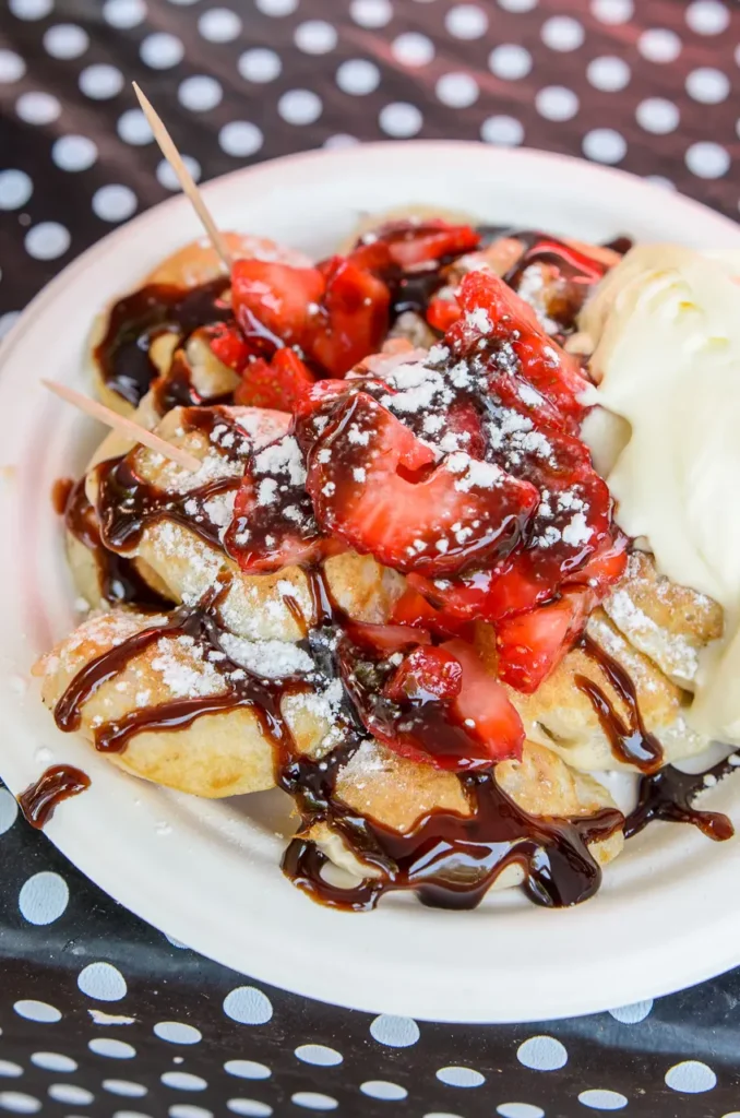 Close-up event food photography of strawberry waffles with chocolate sauce and ice cream at Glebe Street Fair