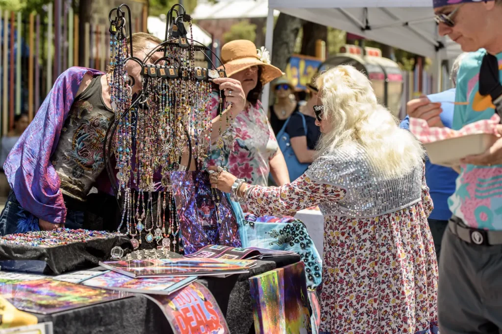 Shoppers browsing colourful handmade jewellery at Glebe Street Fair Sydney, photographed by Koshka Media