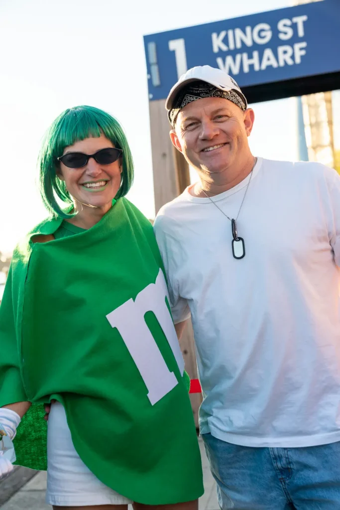 Costume party guests at King Street Wharf before boarding a Sydney Harbour cruise
