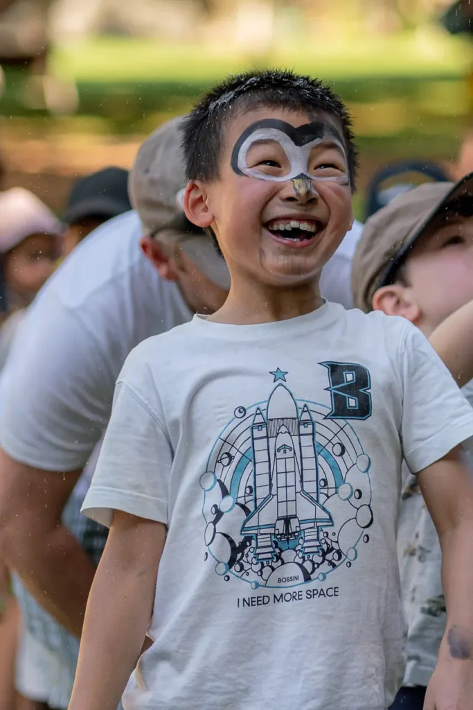 Community event photography of a smiling child with face paint at the St Leonards Park opening